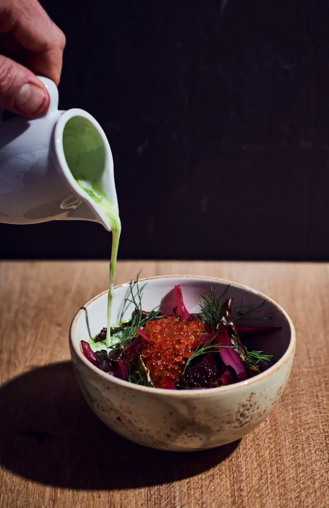 Green salad with beets and salmon caviar