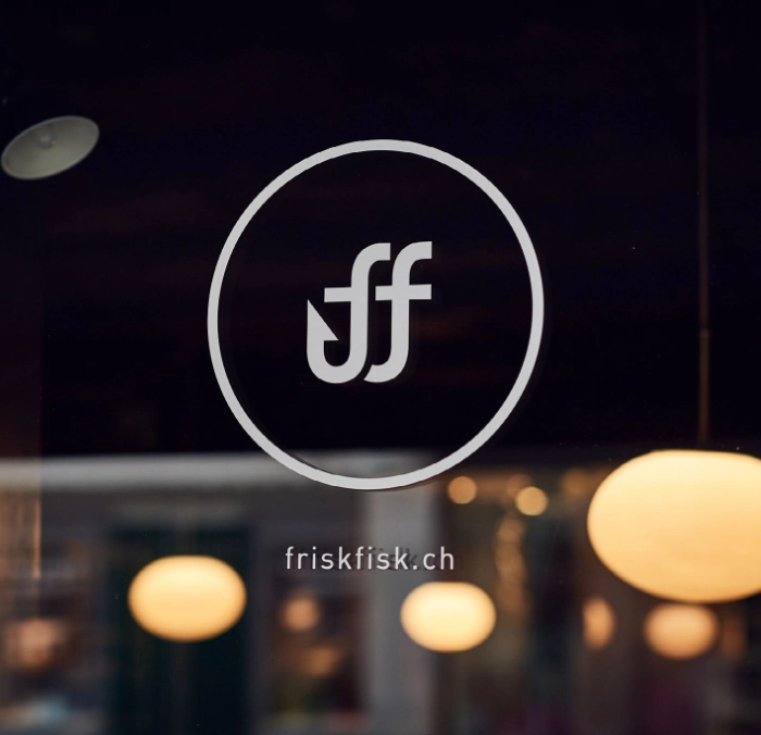 Plate with salmon slice, pickled vegetables, and foam